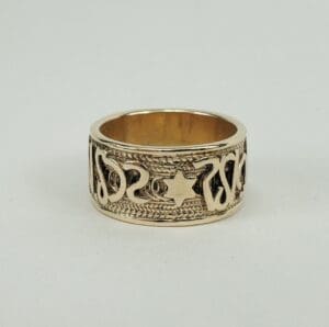 Ornate gold ring with intricate design.