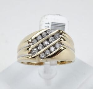 Gold ring with diagonal diamond rows.
