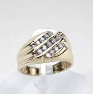 Gold ring with diagonal diamond accents.