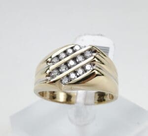 Gold ring with diagonal diamond accents.