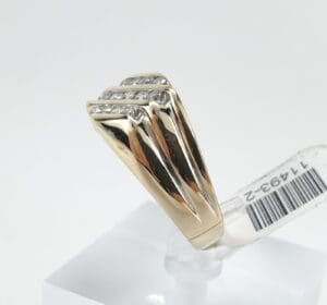 Gold ring with diamond accents on display.