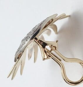Gold and silver clip-on earring design.