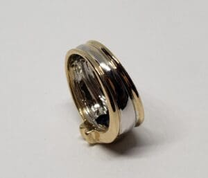 Gold and silver two-tone ring on display.