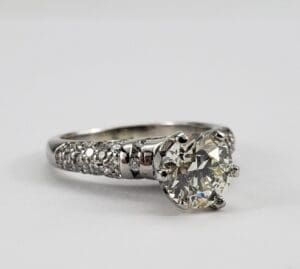 Diamond engagement ring with intricate band design.