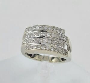 Silver ring with multiple diamond rows.
