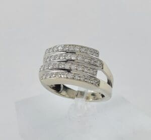 Silver ring with multiple diamond bands.