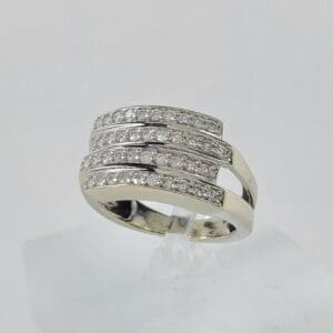 Silver ring with multiple diamond bands.