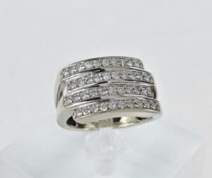 Silver ring with multiple diamond rows.
