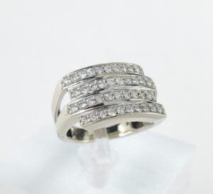 Silver ring with multiple diamond-studded bands.