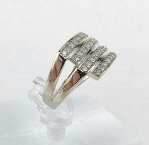 Silver ring with multiple diamond rows.