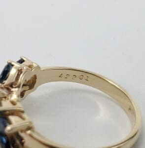 Gold ring with engraved number 42261.