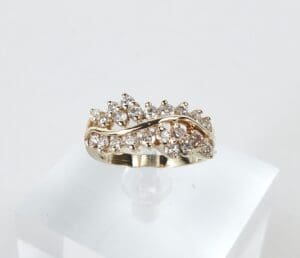 Gold ring with diamond cluster design.
