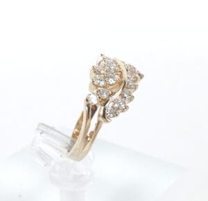 Gold ring with diamond cluster design.