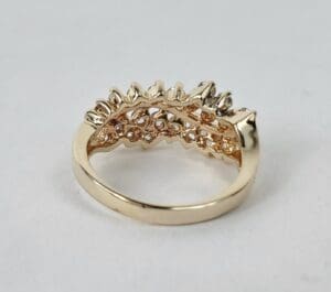 Gold ring with intricate design details.