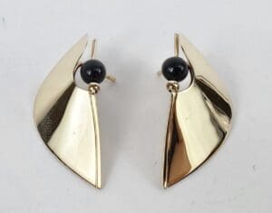 Gold abstract earrings with black beads.
