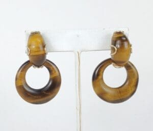 Brown hoop earrings with circular design.