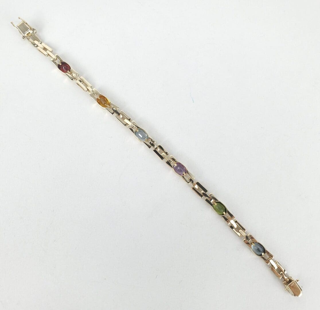 Bracelet with colorful stones on white background.