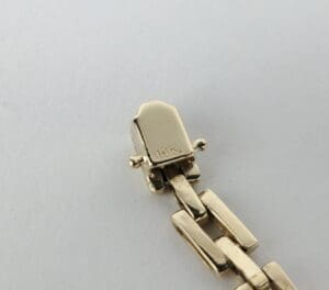 Gold bracelet clasp stamped with 14K.