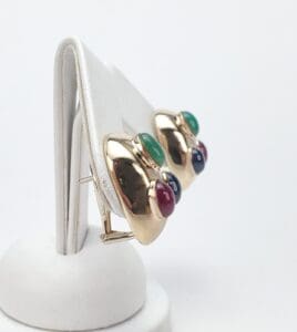 Gold earrings with colorful gemstone accents.