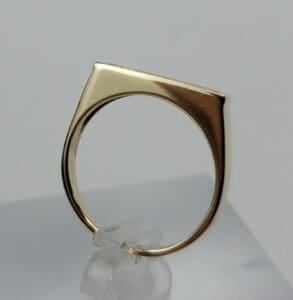 Gold ring with unique geometric design.