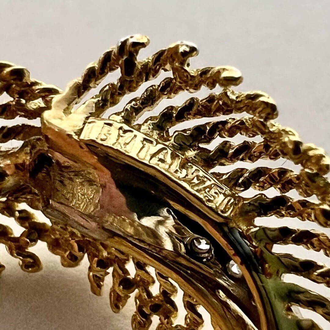 Gold textured jewelry with intricate detailing.