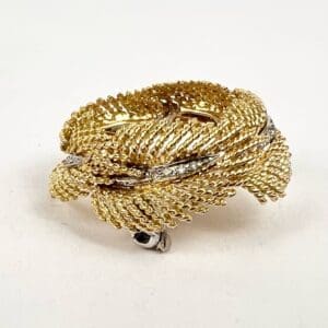 Gold braided ring with silver accents.