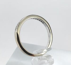 Gold and silver ring on display stand.
