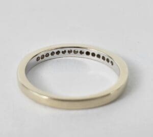 Silver ring with small interior stones.