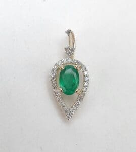 Emerald and diamond teardrop pendant jewelry.