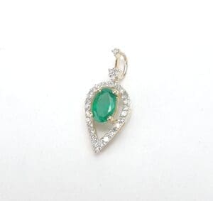 Teardrop pendant with emerald and diamonds.