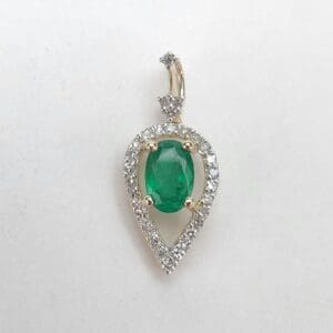 Emerald and diamond teardrop pendant jewelry.