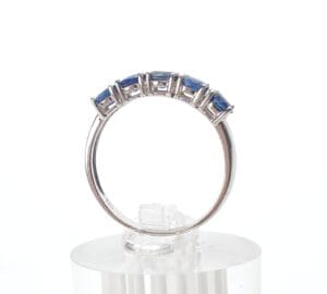Silver ring with blue gemstone accents.