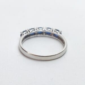 Silver ring with blue gemstones.