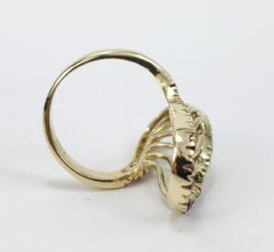 Gold ring with intricate decorative design.