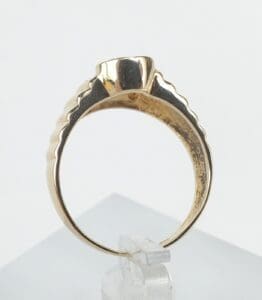Gold ring with unique band design.