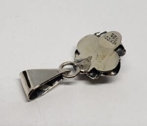 Silver clover pendant with Mexico engraving.