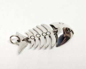Fishbone-shaped silver keychain on white background.
