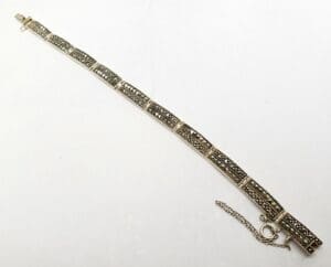 Vintage silver bracelet with intricate design.