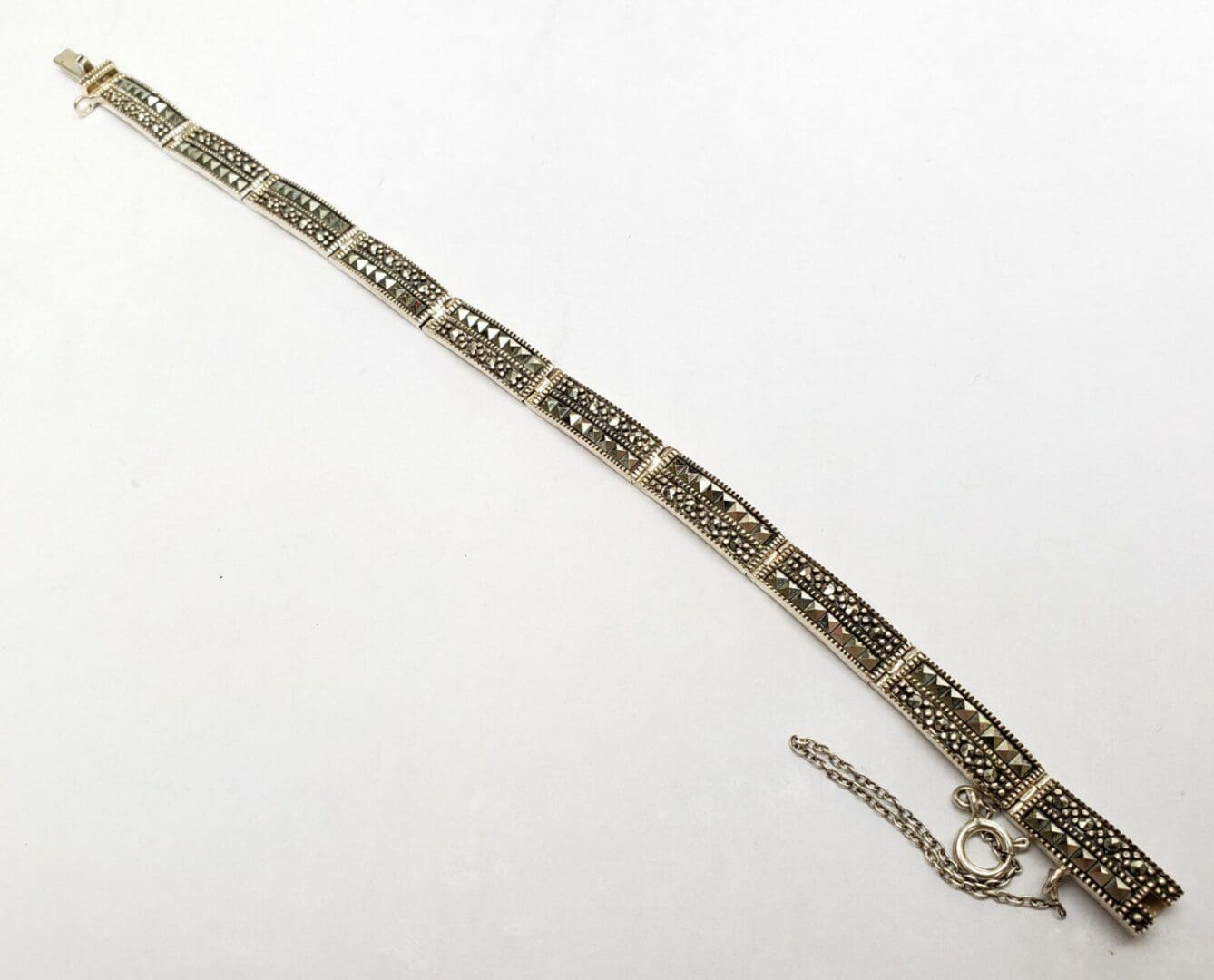 Vintage silver bracelet with intricate design.