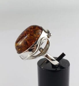 Silver ring with large amber stone.