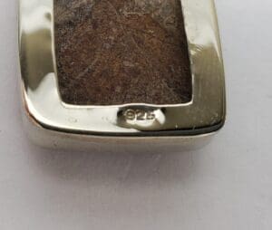 Silver pendant with brown stone, marked 925.