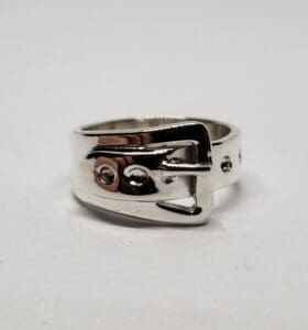 Silver ring with buckle design.