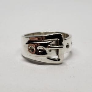 Silver ring with buckle design.