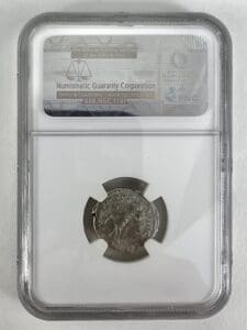 Ancient coin in protective display case.