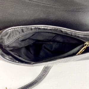 Open black handbag with zippered pocket.