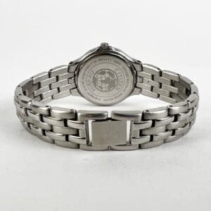Stainless steel watch with engraved backplate.