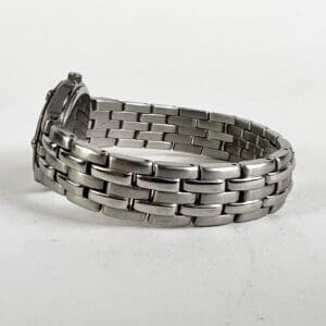 Silver metal watch with link bracelet.