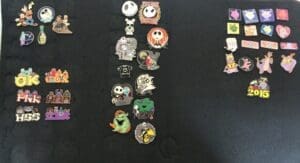 Collection of various colorful enamel pins.