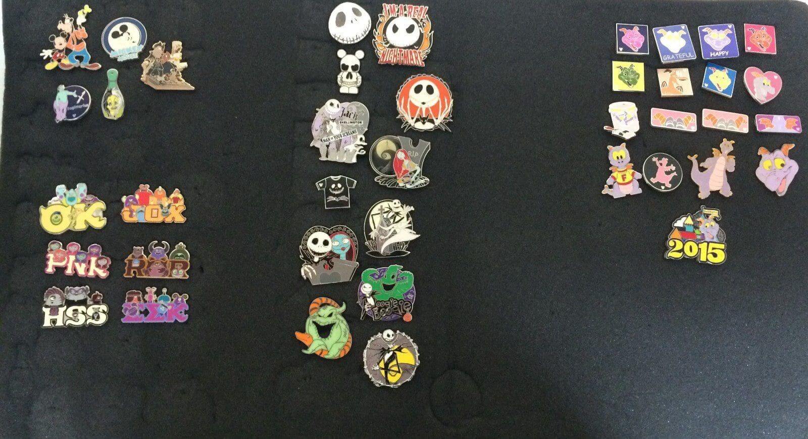 Collection of various colorful enamel pins.
