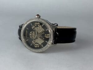 Luxury watch with jeweled skull design.